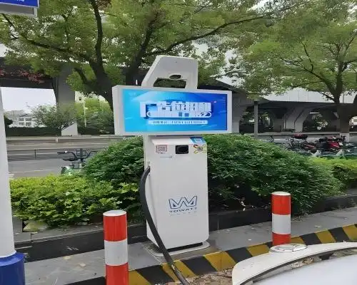 What is the purpose of the advertising display on a charging station?